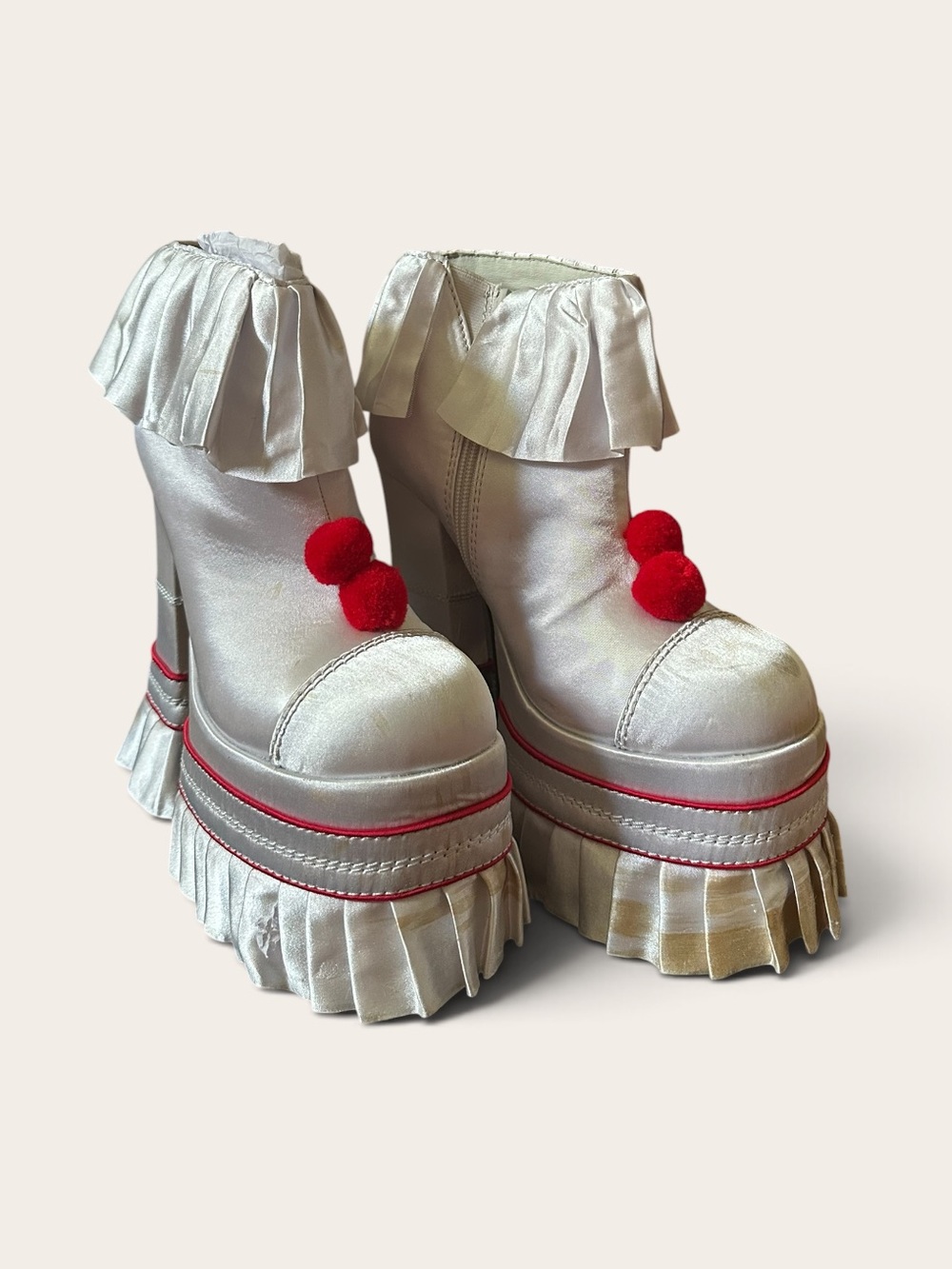 Dolls Kill Cream Platform Fringe Ankle Boots with Red Pom Accents